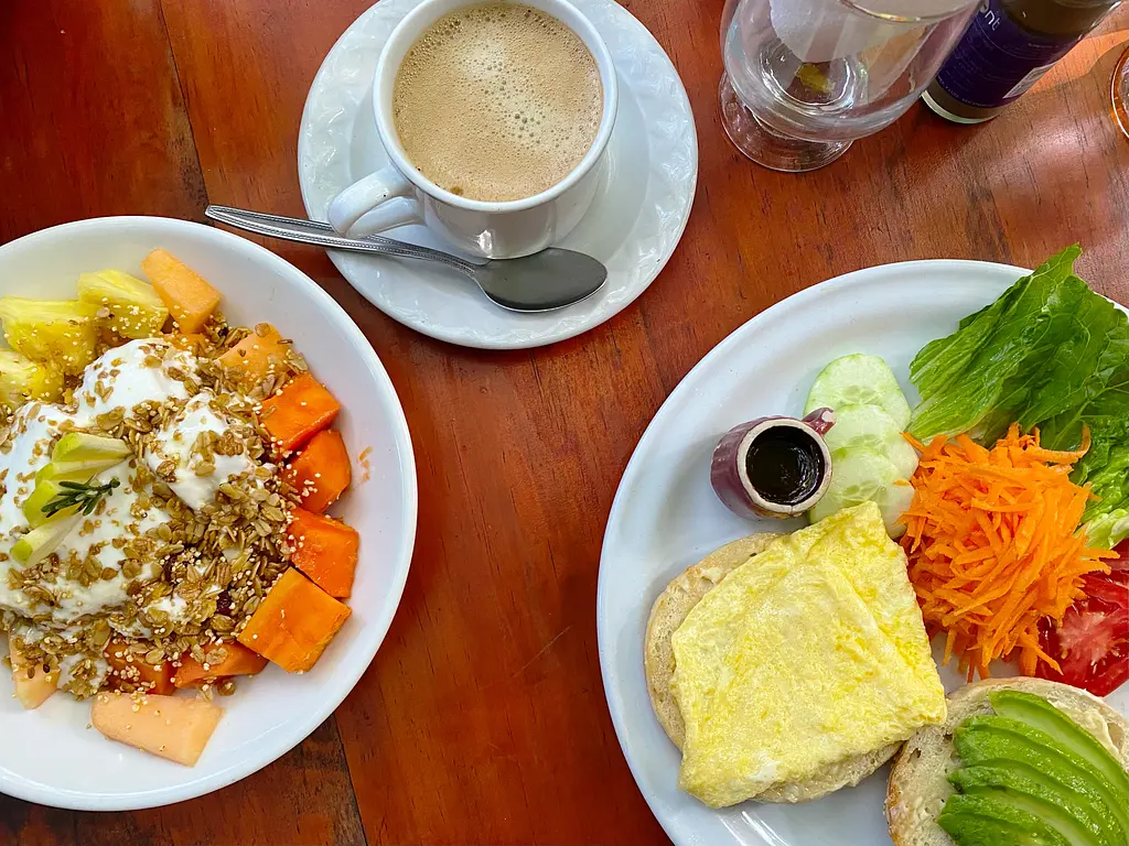 Cafe Orale - Bowl of Fruit & Yogurt, Eggs, Avoccado Toast, and Coffee!