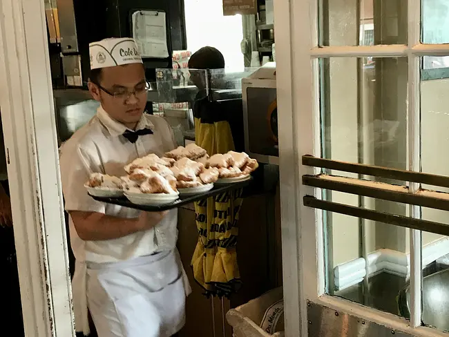 Two Gay Expats - New Orleans, Louisiana, United States - Cafe Du Monde - Waiter With Beignets