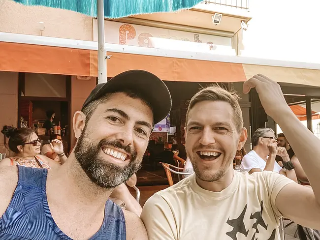 Two Gay Expats at Parrots Cafe in Sitges, Spain